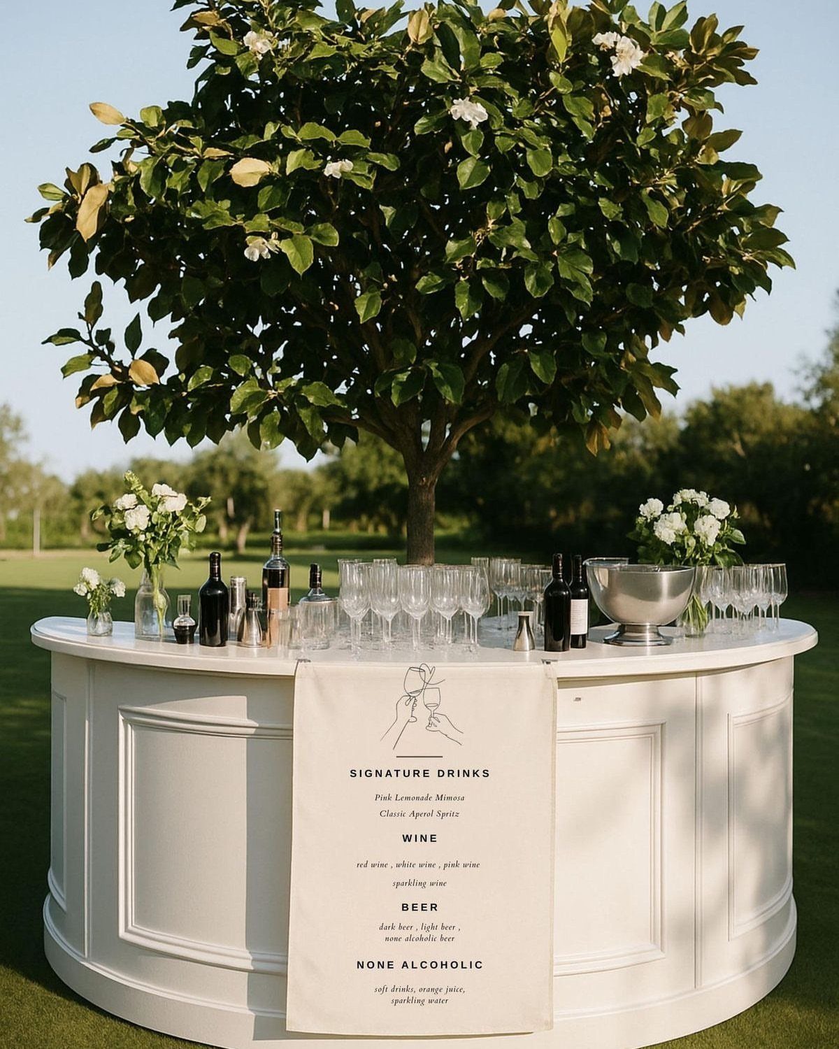 White curved outdoor beverage bar with wine, glasses, and a drink menu.