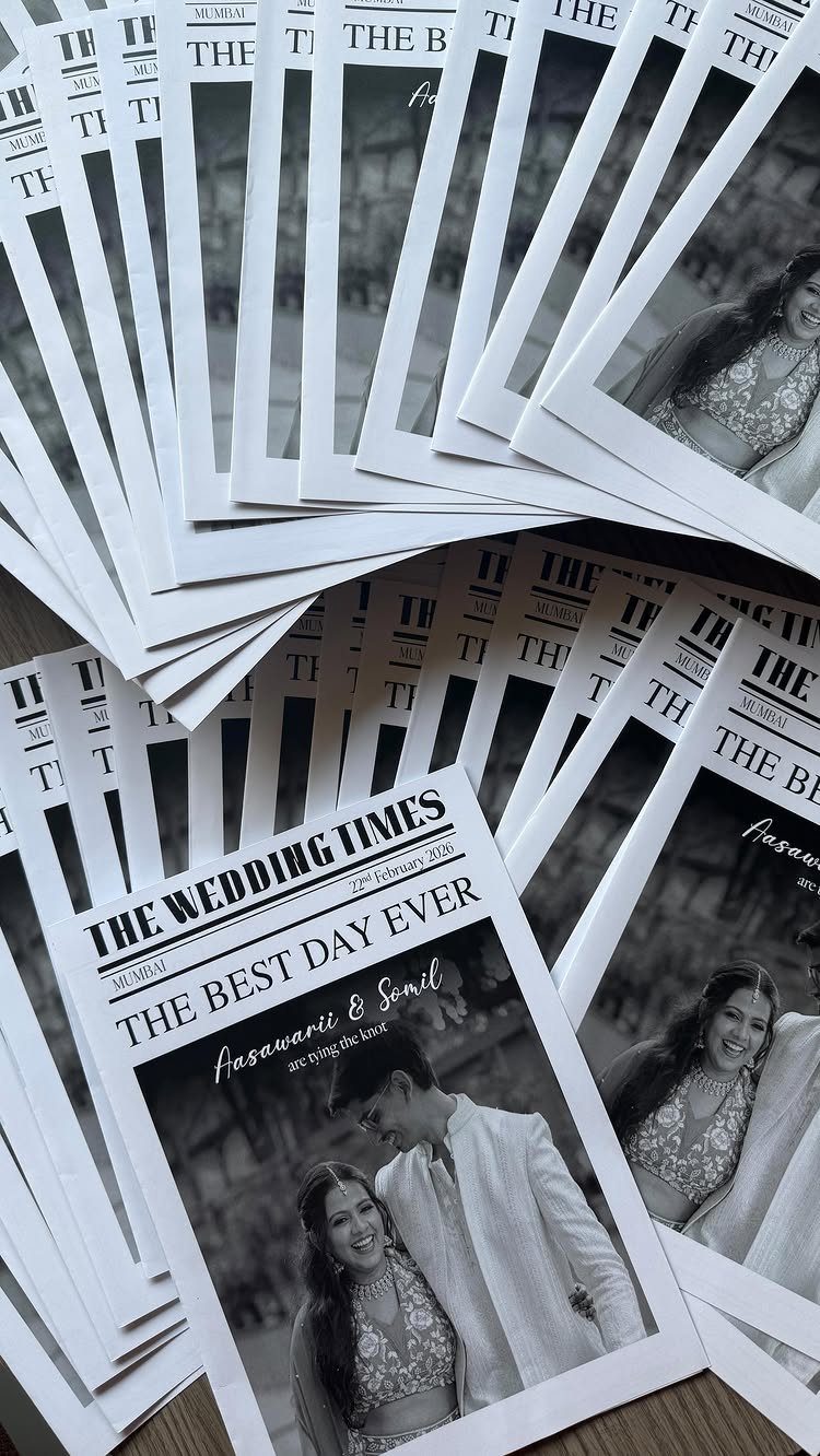 Wedding newspapers titled The Wedding Times featuring a black and white couple photo.
