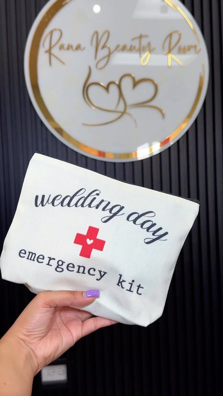 White fabric wedding day emergency kit pouch held against a beauty room background.