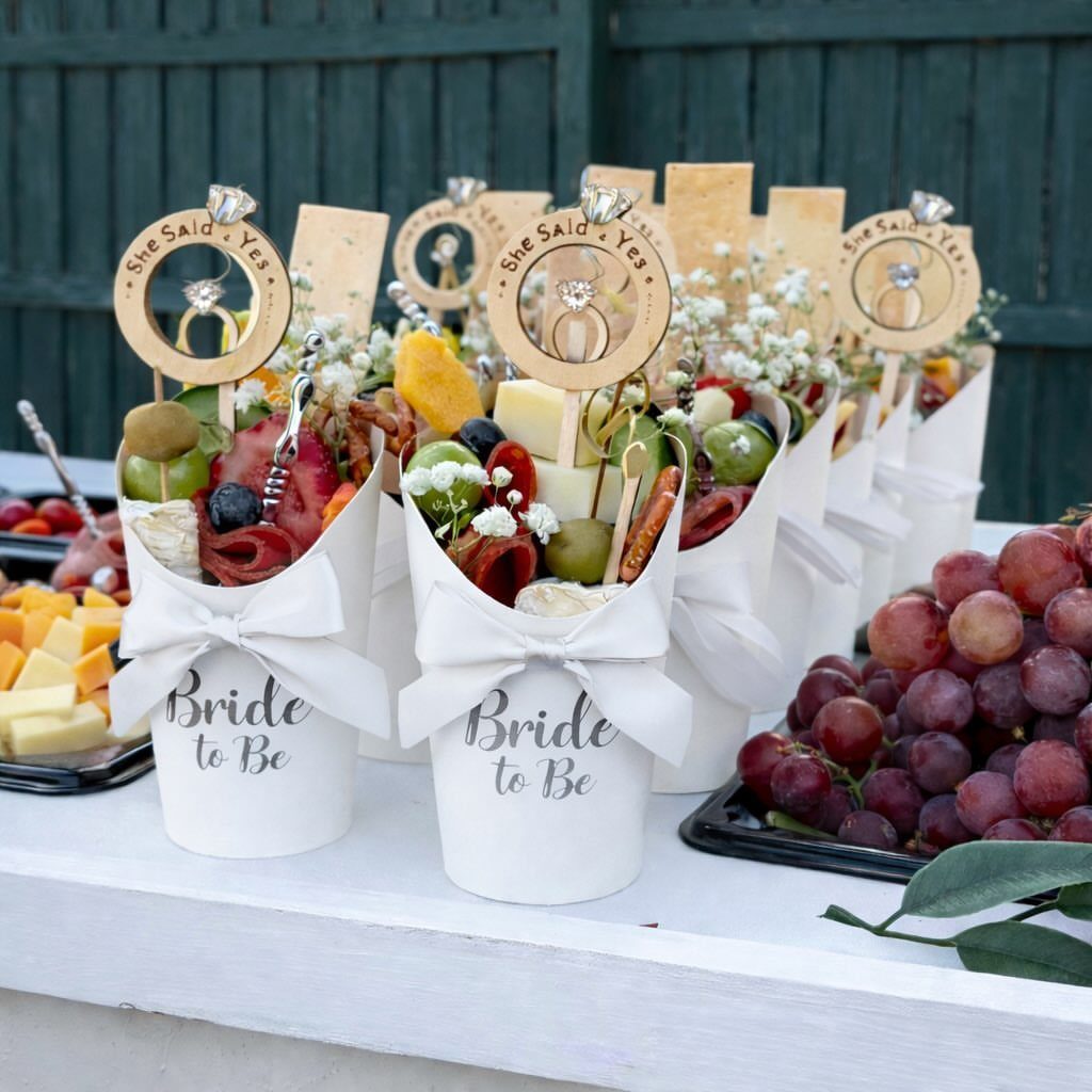 Charcuterie cones with cheese and grapes labeled Bride to Be for wedding snacks