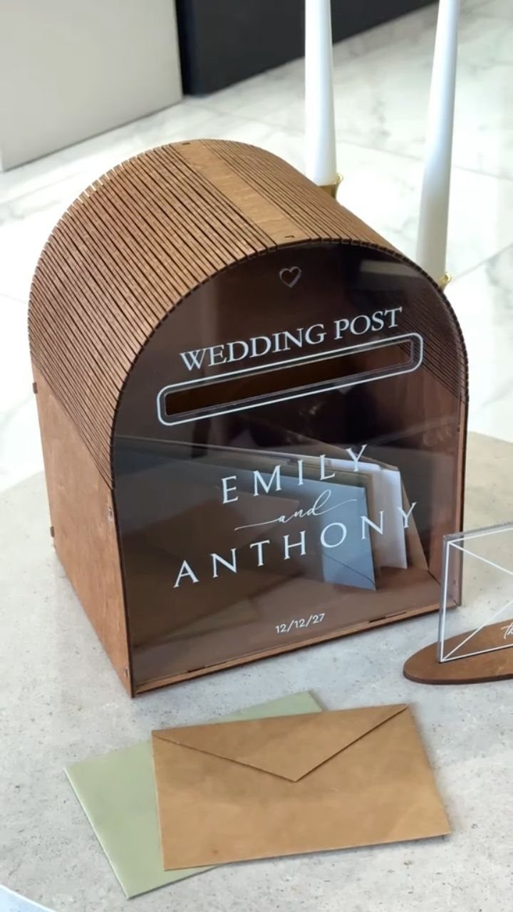 Wooden wedding mailbox with acrylic front personalized with names and wedding date.