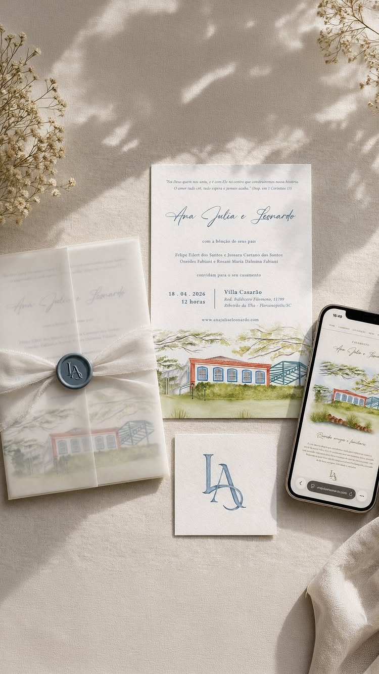 Wedding invitation suite with a blue LA monogram on a light beige background.