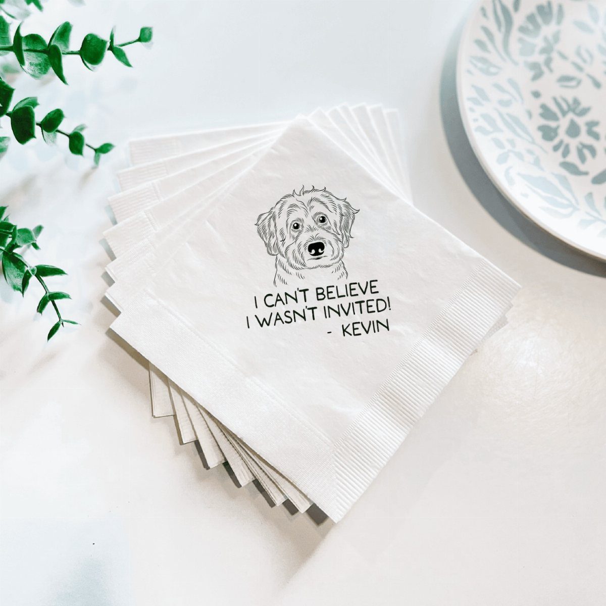 White square napkins featuring a dog illustration and a funny invitation quote.