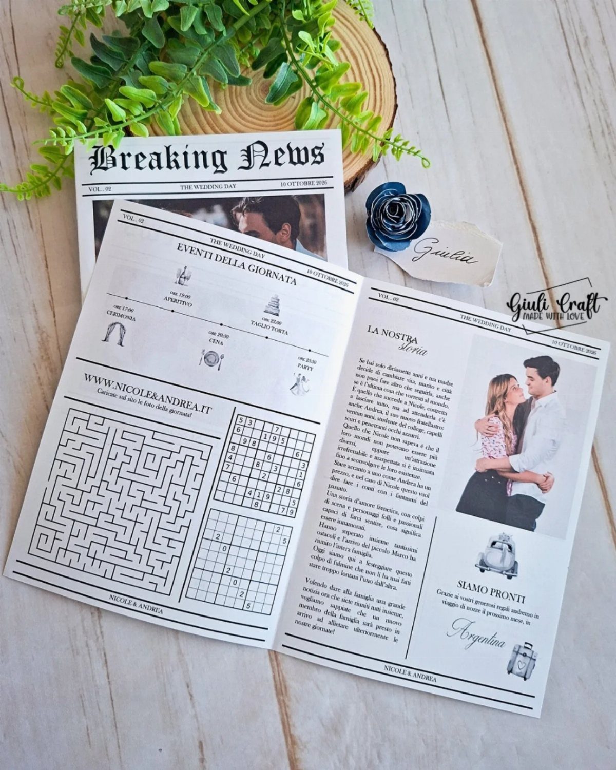 Wedding newspaper featuring a maze and crossword puzzle on a wooden table.
